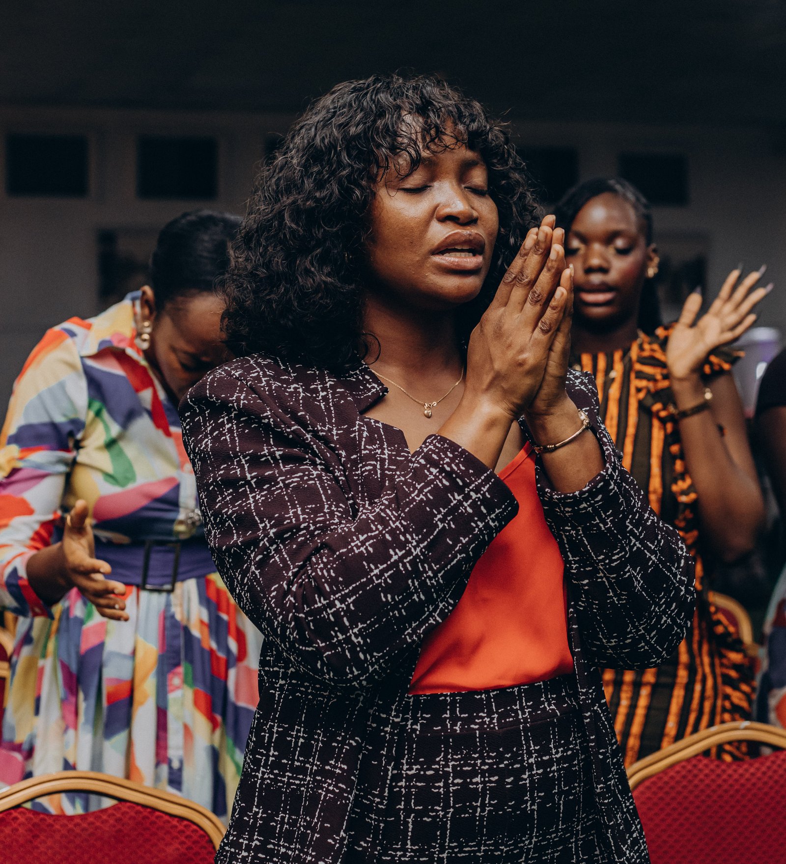 A young girl at Rig Church Lagos holding a welcome sign